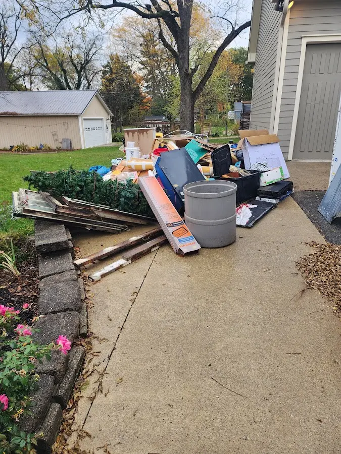 Dumpster being loaded with debris for 10 Yard Dumpster Rental in Steelton